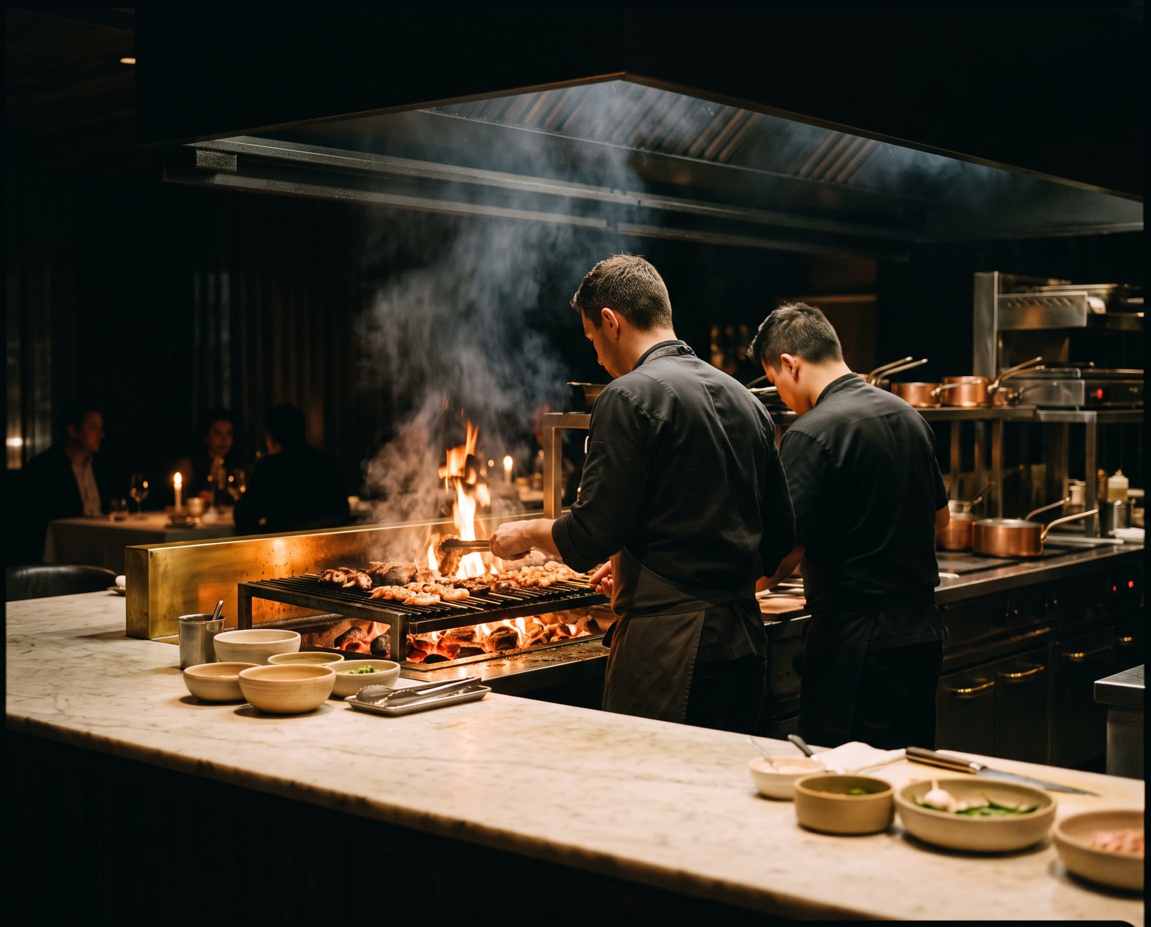 The open kitchen at L’Élite during evening service